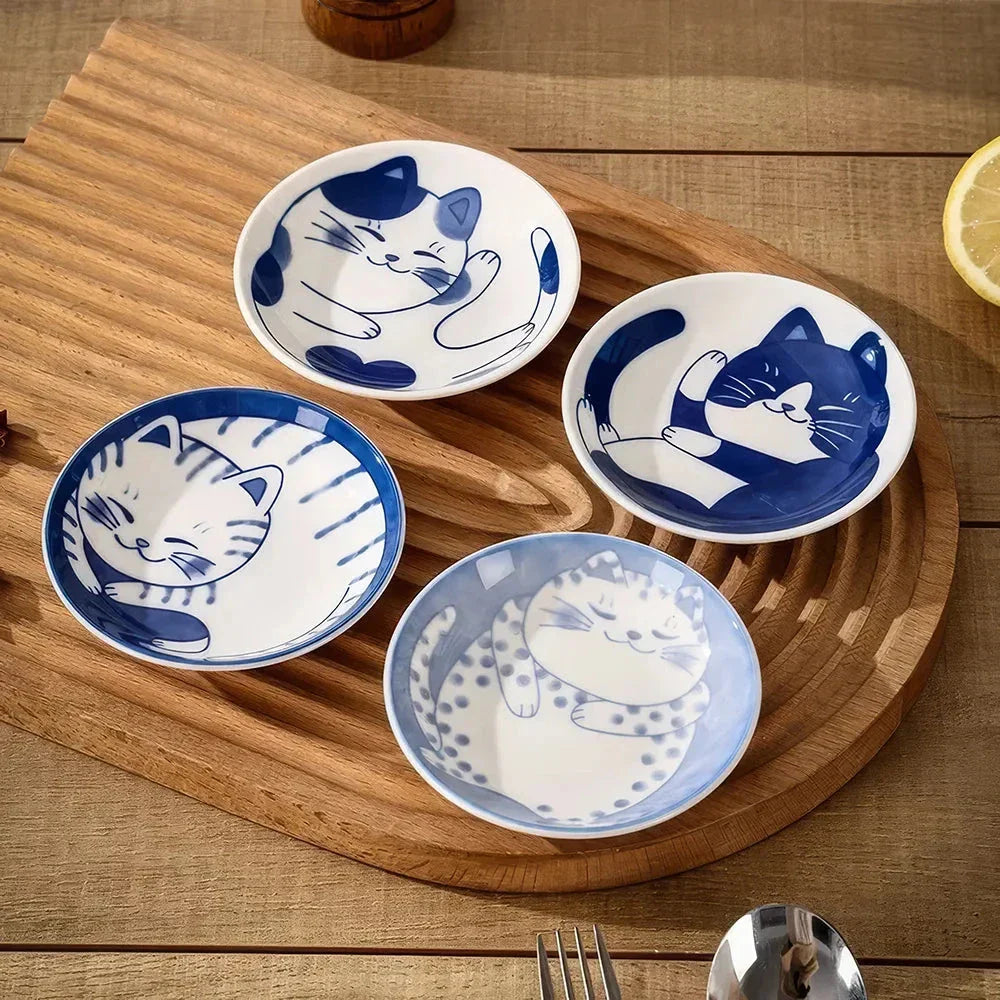 Charming Japanese ceramic sauce dish with a lucky cat design, perfect for serving sauces, sushi, and more.