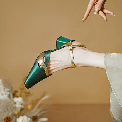 Elegant green high heel sandals with ankle strap, showcasing a sophisticated square heel design and premium materials