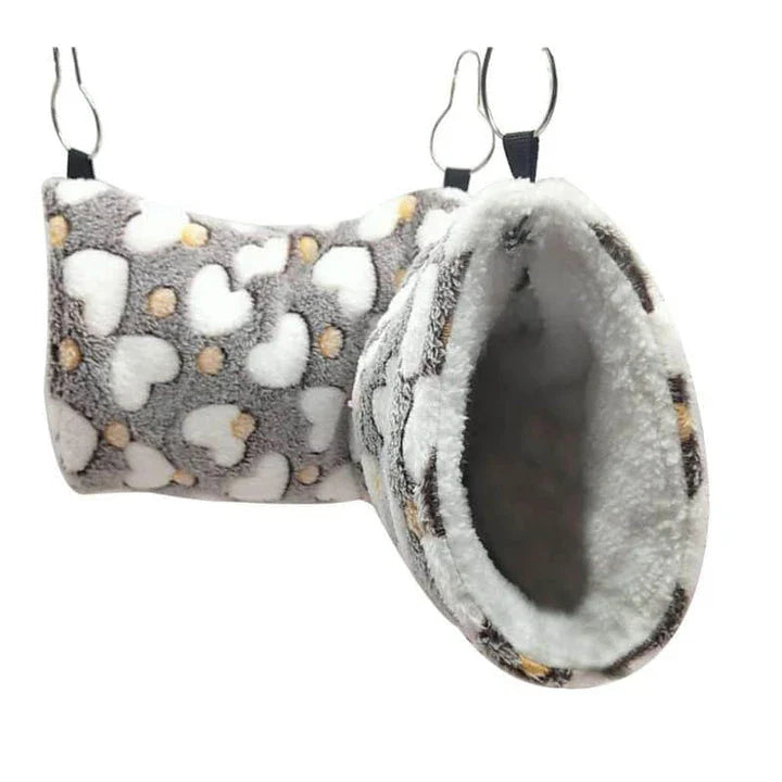 Cosy plush tunnel in grey for small pets like hamsters and guinea pigs, providing a comfortable and secure hideaway