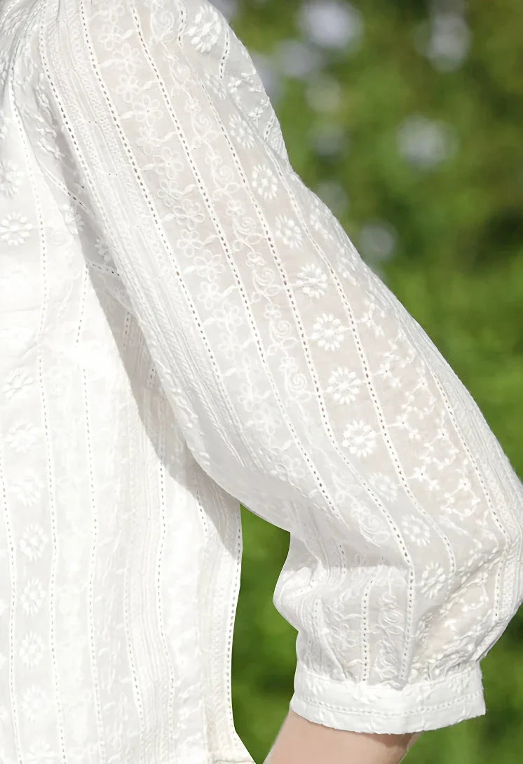 Elegant British-inspired white cotton puff sleeve blouse with a tailored regular fit and feminine flair