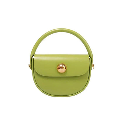 Exquisite red leather round handbag with ball-inlaid hardware, a chic and versatile accessory for UK fashion enthusiasts