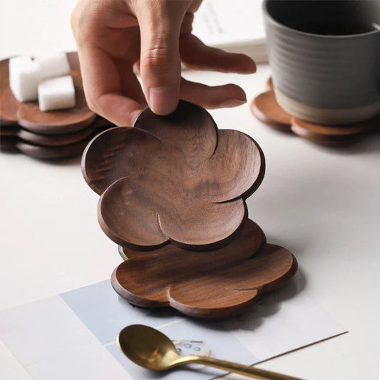 Set of elegant Japanese-inspired walnut wood flower coasters with unique textures and natural variations