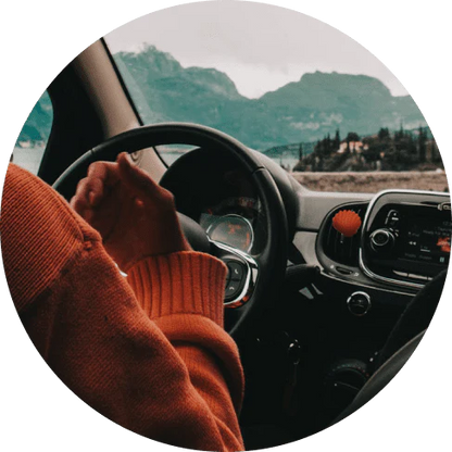 Orange flower-shaped clip-on air freshener for vehicles, providing long-lasting Squash Marine scent