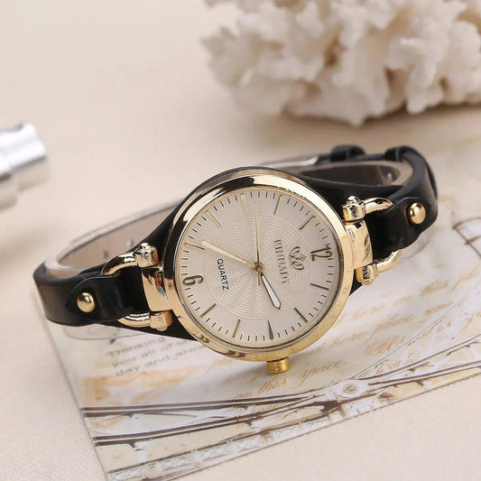 Elegant women's quartz watch with a black leather strap, featuring a sleek alloy case and a durable glass dial window