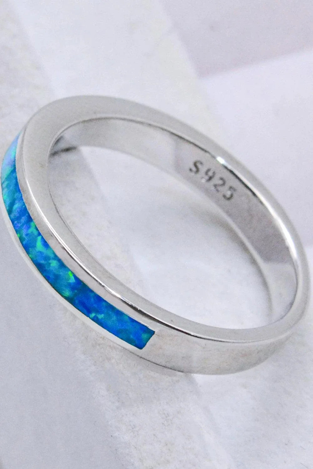 Elegant sterling silver ring with a mesmerizing sky blue opal gemstone, a modern and sophisticated accessory.