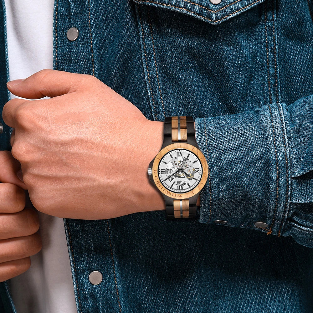 Elegant mechanical watch with wood strap, stainless steel buckle, and pointer display, showcasing British craftsmanship and precision timekeeping.
