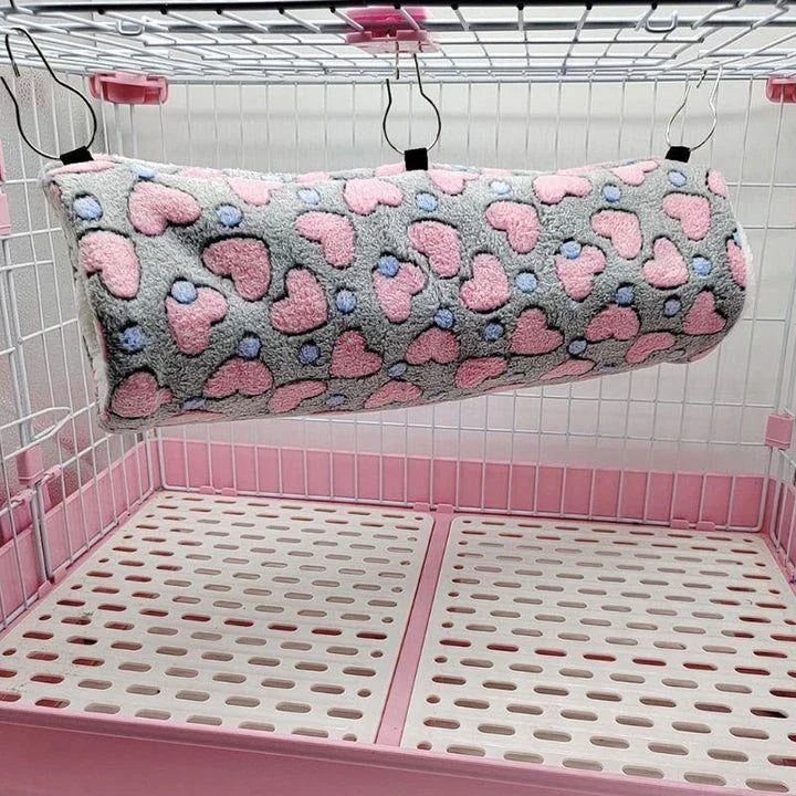 Cosy plush tunnel in grey for small pets like hamsters and guinea pigs, providing a comfortable and secure hideaway