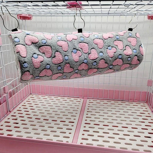 Cosy plush tunnel in grey for small pets like hamsters and guinea pigs, providing a comfortable and secure hideaway