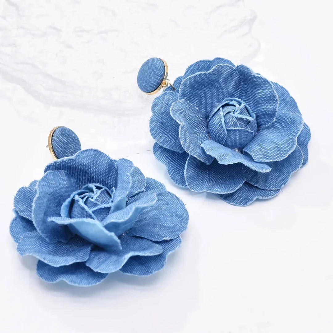 Elegant denim drop earrings with intricate details, a versatile accessory that adds a touch of refined British style to any outfit.