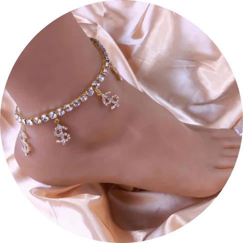 Elegant brass anklet with shimmering dollar pendants and rhinestones