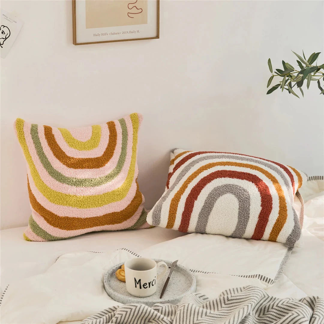 Bohemian-inspired microfibre cushion cover in light pink and white with a cosy, fuzzy texture