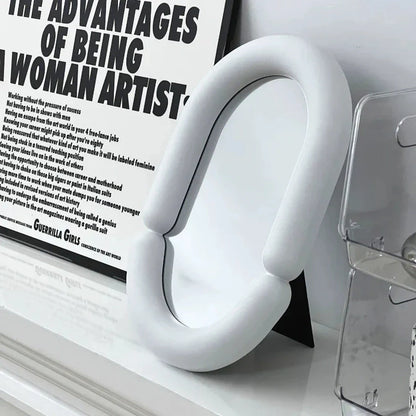 Elegant irregular oval-shaped black tabletop mirror for sophisticated home decor