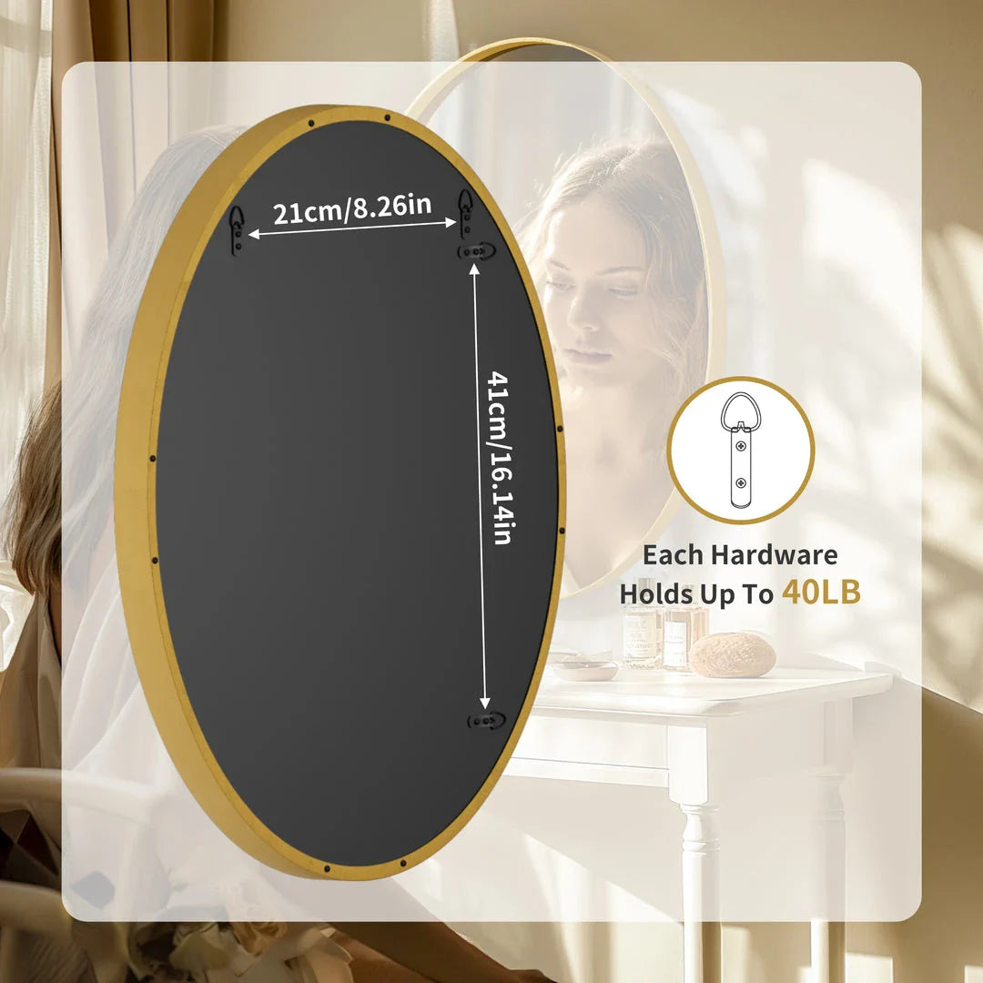 Elegant oval gold wall mirror with a contemporary decorative brushed gold frame