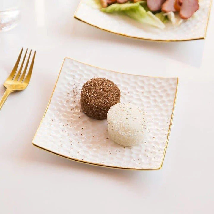 Elegant embossed ceramic cake plate in white color, perfect for serving cakes and pastries during afternoon tea