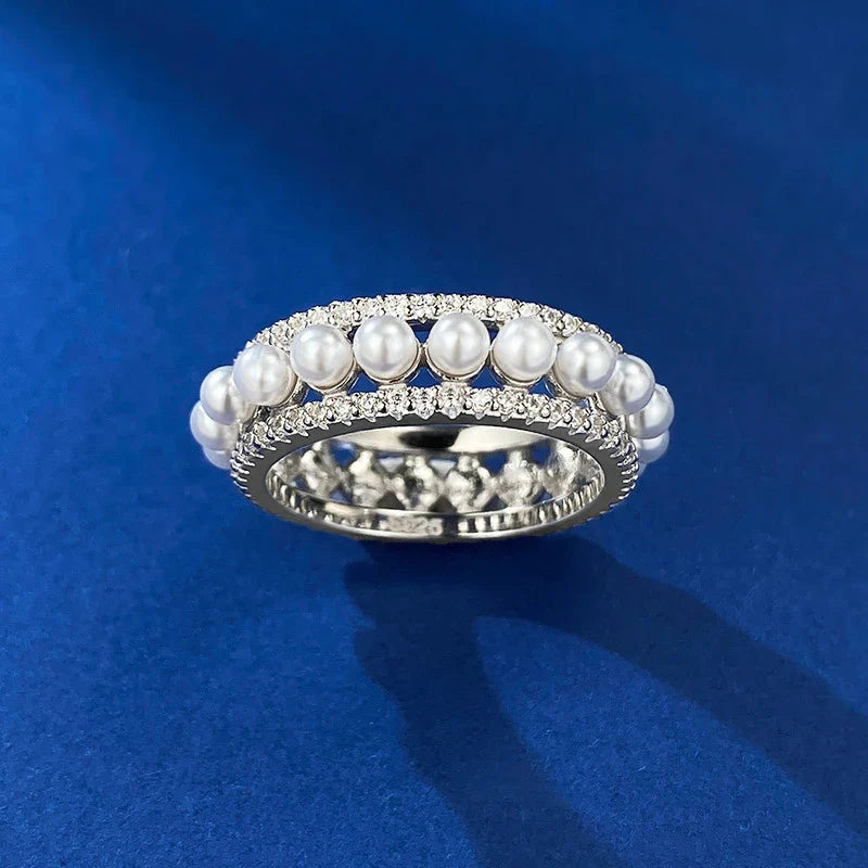 A beautiful 925 sterling silver ring with a delicate pearl accent, designed for the discerning British woman
