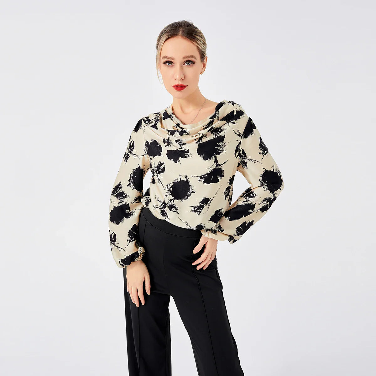 Elegant ladies' blouse with a printed pattern, dropped collar, and long sleeves in a classic white colour