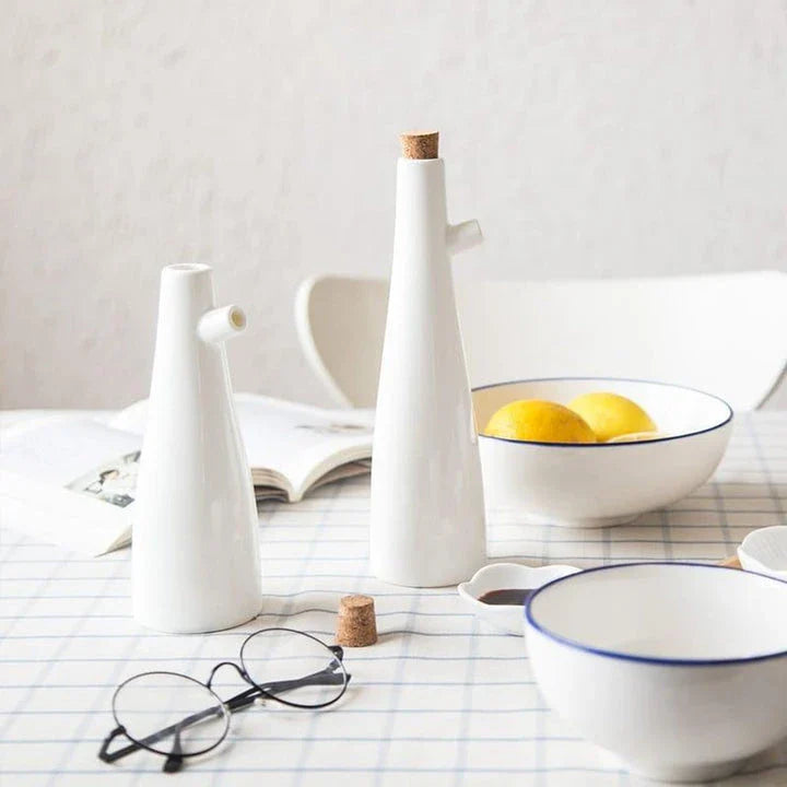 Elegant white porcelain storage bottles with Mediterranean-inspired design for kitchen organisation and decor