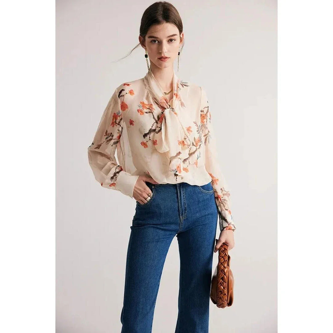 Elegant floral pattern silk and viscose blend blouse with bow collar and puff sleeves