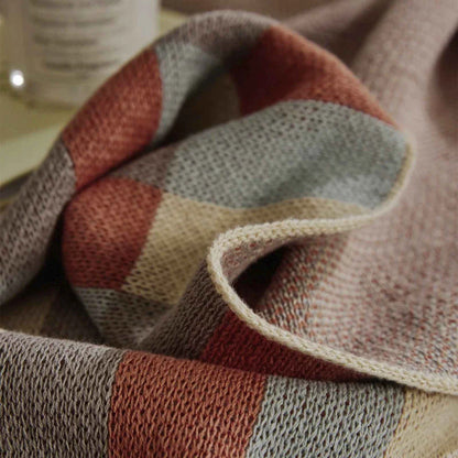 Cosy 100% cotton striped plaid throw blanket in vibrant orange and blue hues, perfect for adding rustic charm to any living space.