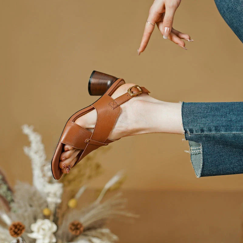 Elegant leather high heel sandals in khaki colour for women, featuring a 5.5 cm square heel, secure buckle strap, and sleek design.