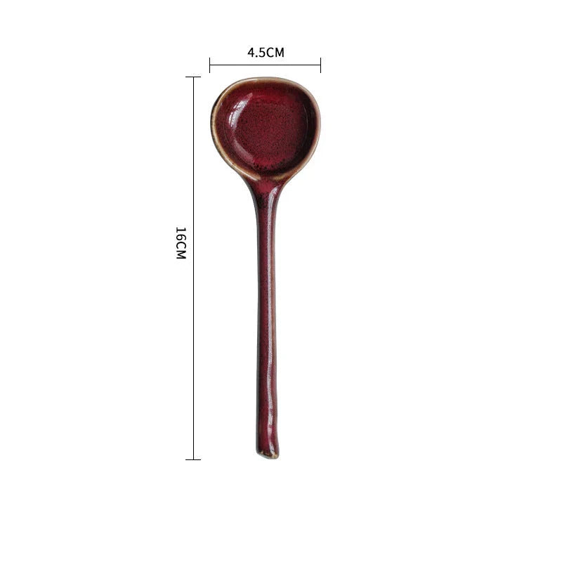 Elegant British ceramic soup spoon with long handle and vibrant glaze for refined dining experience