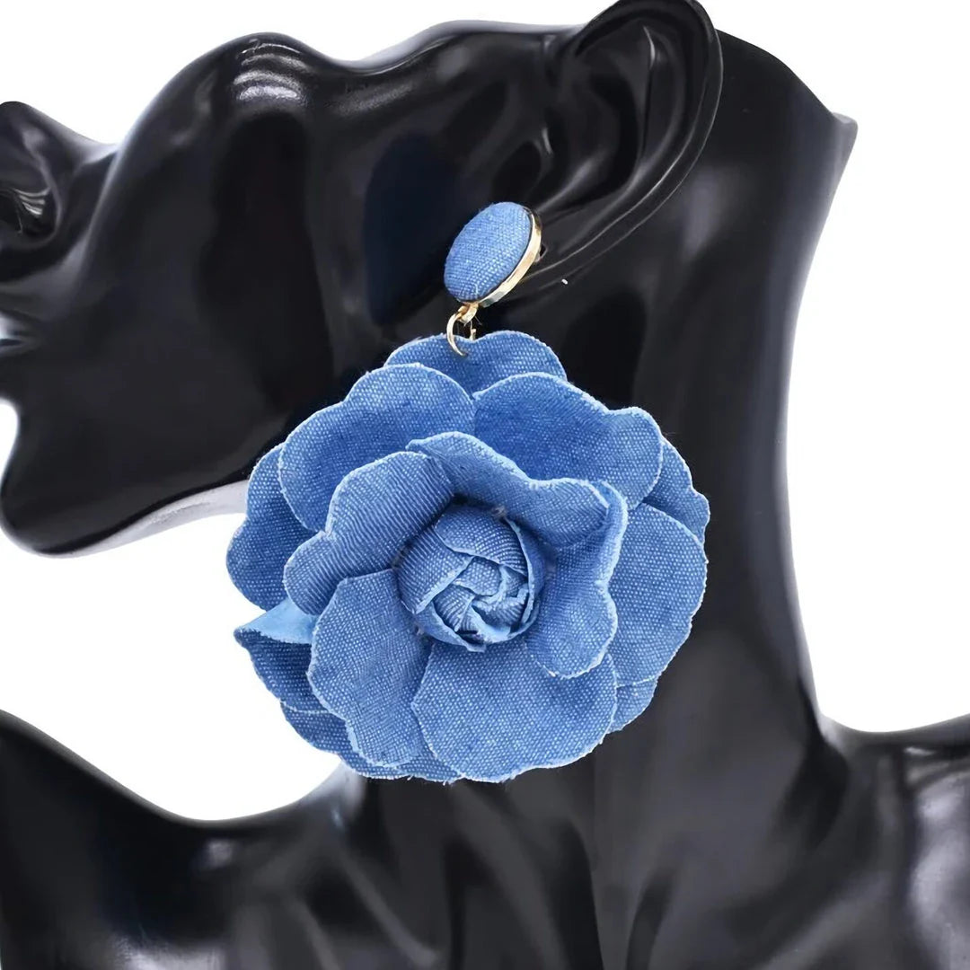 Elegant denim drop earrings with intricate details, a versatile accessory that adds a touch of refined British style to any outfit.