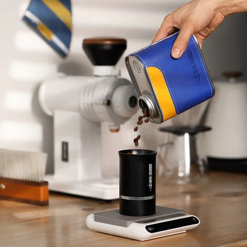 Airtight metal coffee and tea canister with portable filter paper storage, perfect for camping and home use