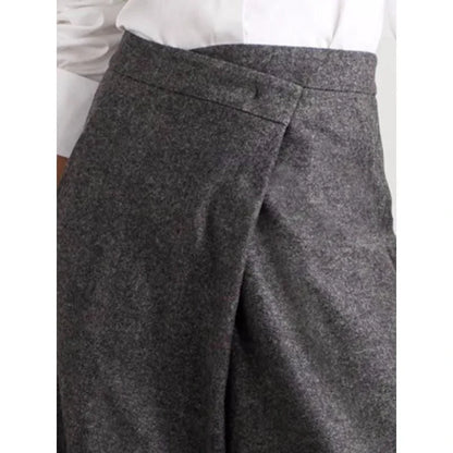 Elegant woollen wide-leg trousers in a high-waist design with unique asymmetric detailing, perfect for the discerning British woman.