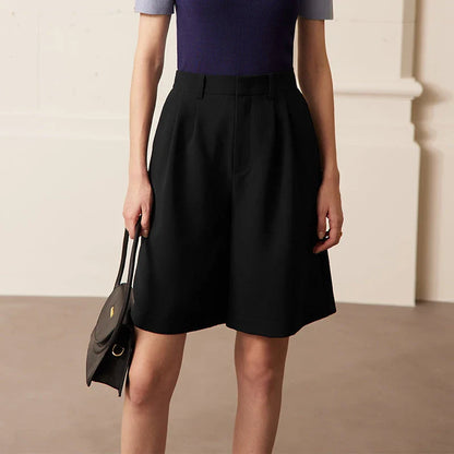 Elegant wide-leg shirred shorts in deep blue, designed for the modern British woman
