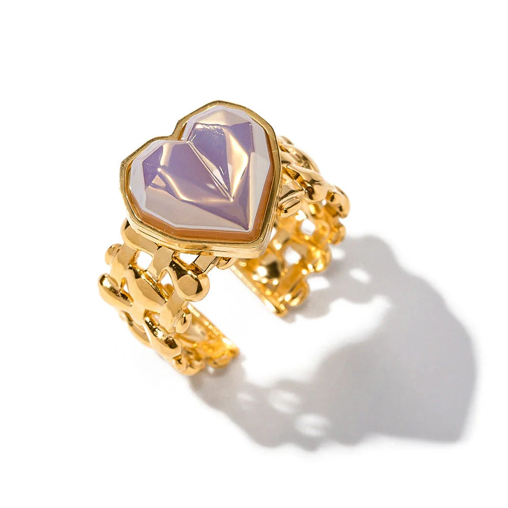 Adjustable stainless steel ring with a mermaid-inspired heart design and shell beads, a unique and versatile accessory.