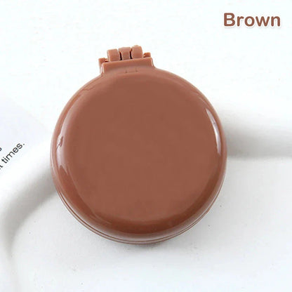 Portable folding hair comb with mirror, featuring a dual-sided design with a round mirror and eco-friendly hairbrush for on-the-go styling and grooming