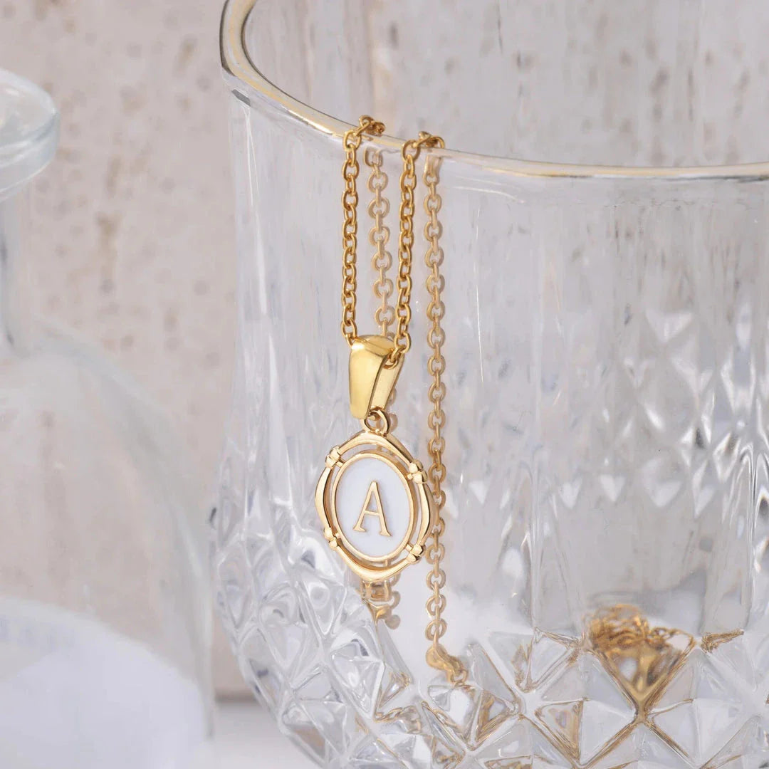 Elegant gold-tone letter pendant necklace with innovative drip oil design and integrated fitness tracker