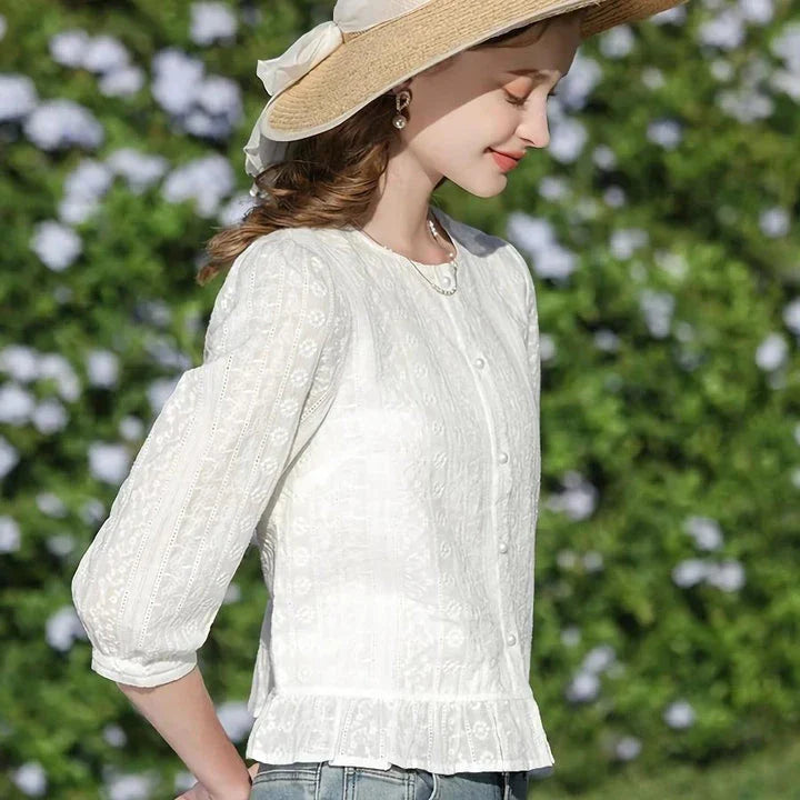 Elegant British-inspired white cotton puff sleeve blouse with a tailored regular fit and feminine flair