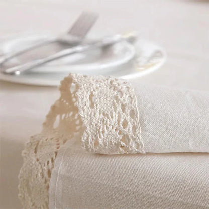 Elegant polyester linen tablecloth with delicate lace edging, available in various sizes for a sophisticated dining experience.