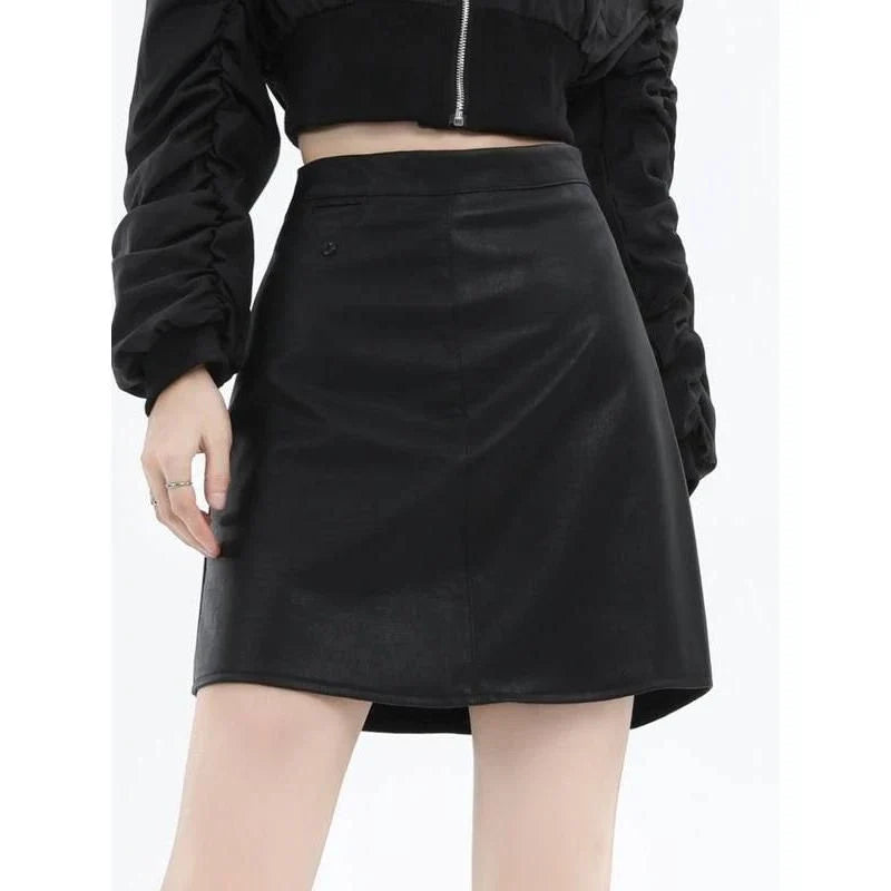 A chic faux leather high-waisted mini skirt in black, perfect for the modern British woman's autumn and winter wardrobe.