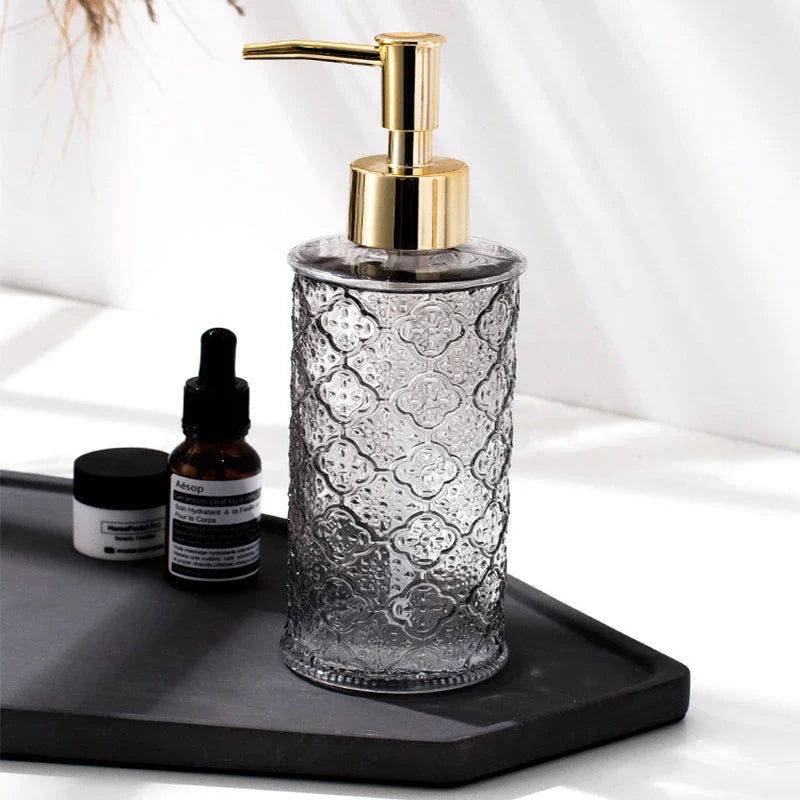 Elegant glass soap dispenser with sleek, minimalist design for bathroom and kitchen use