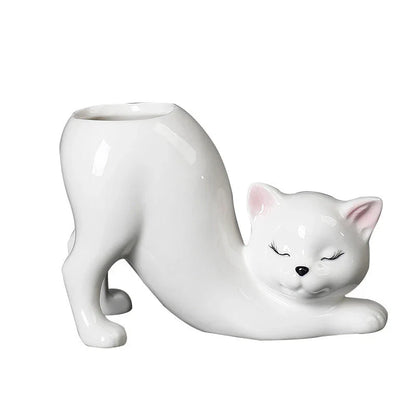 A charming cartoon cat-shaped flower pot made of high-quality glazed porcelain, perfect for adding a playful touch to your home or office decor.