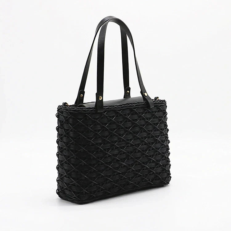 Handwoven rattan handbag in black with a sleek, elegant design for effortless style and practicality