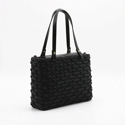 Handwoven rattan handbag in black with a sleek, elegant design for effortless style and practicality