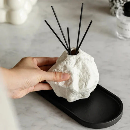 Elegant Nordic-style ceramic aromatherapy diffuser bottle with a modern, rock-inspired design