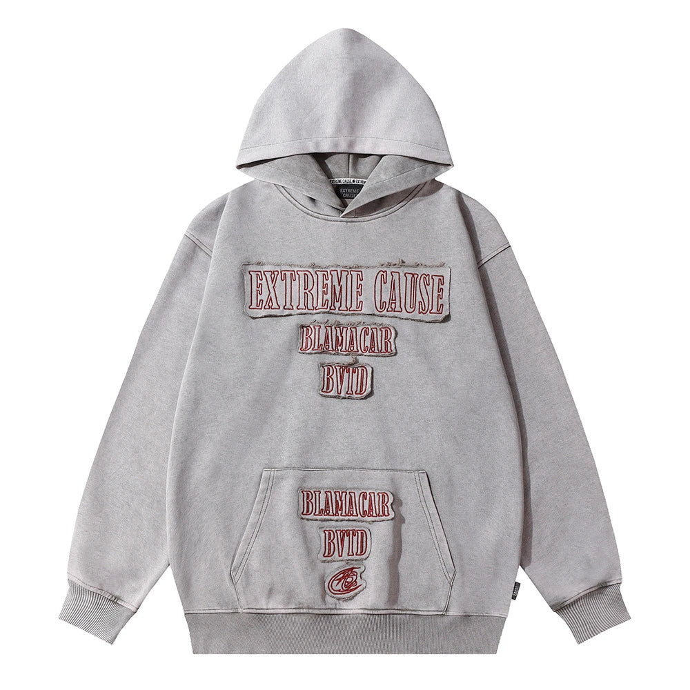 A premium cotton pullover hoodie with an embroidered letter patch in a variety of classic autumn colours