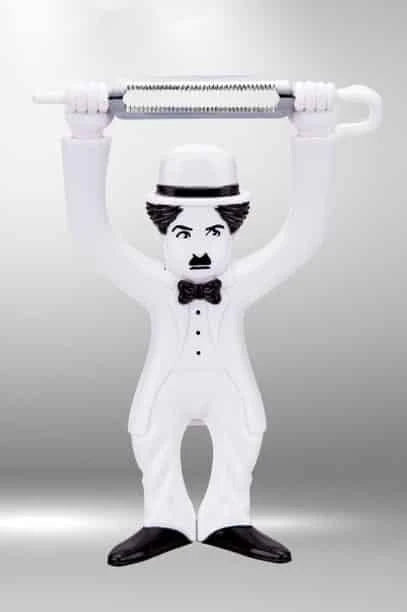 Vintage-inspired plastic fruit and vegetable peelers featuring the iconic silhouette of Charlie Chaplin's Tramp character