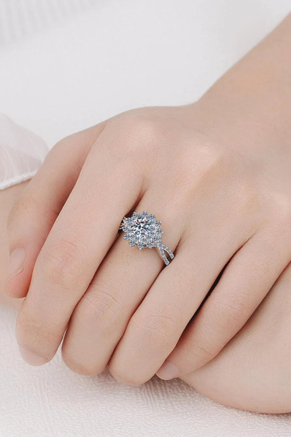 Elegant moissanite flower-inspired split-shank ring in sterling silver and platinum plating
