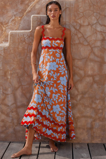 Elegant floral print suspender midi dress in black, perfect for summer beach holidays in the UK