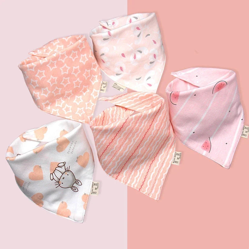 A set of fashionable cotton baby bandana bibs in various prints and colours, designed to keep your little one dry and stylish.