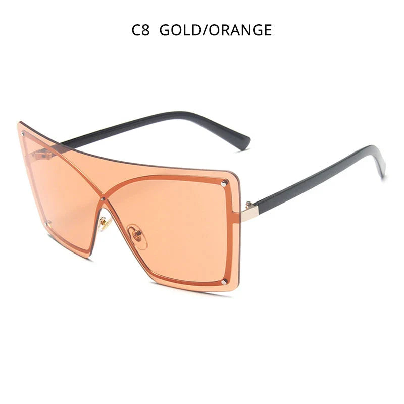 Stylish oversized flat top sunglasses with a rimless design, providing UV protection and a comfortable fit for the modern British woman