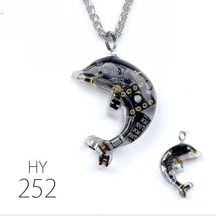 Steampunk-inspired dolphin pendant necklace with electronic components and brass accents