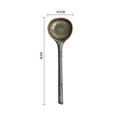 Elegant British ceramic soup spoon with long handle and vibrant glaze for refined dining experience