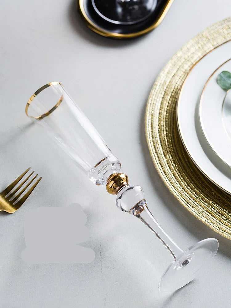 Elegant crystal wine glasses with a gold vertical pattern design, perfect for enjoying your favourite wines in style.