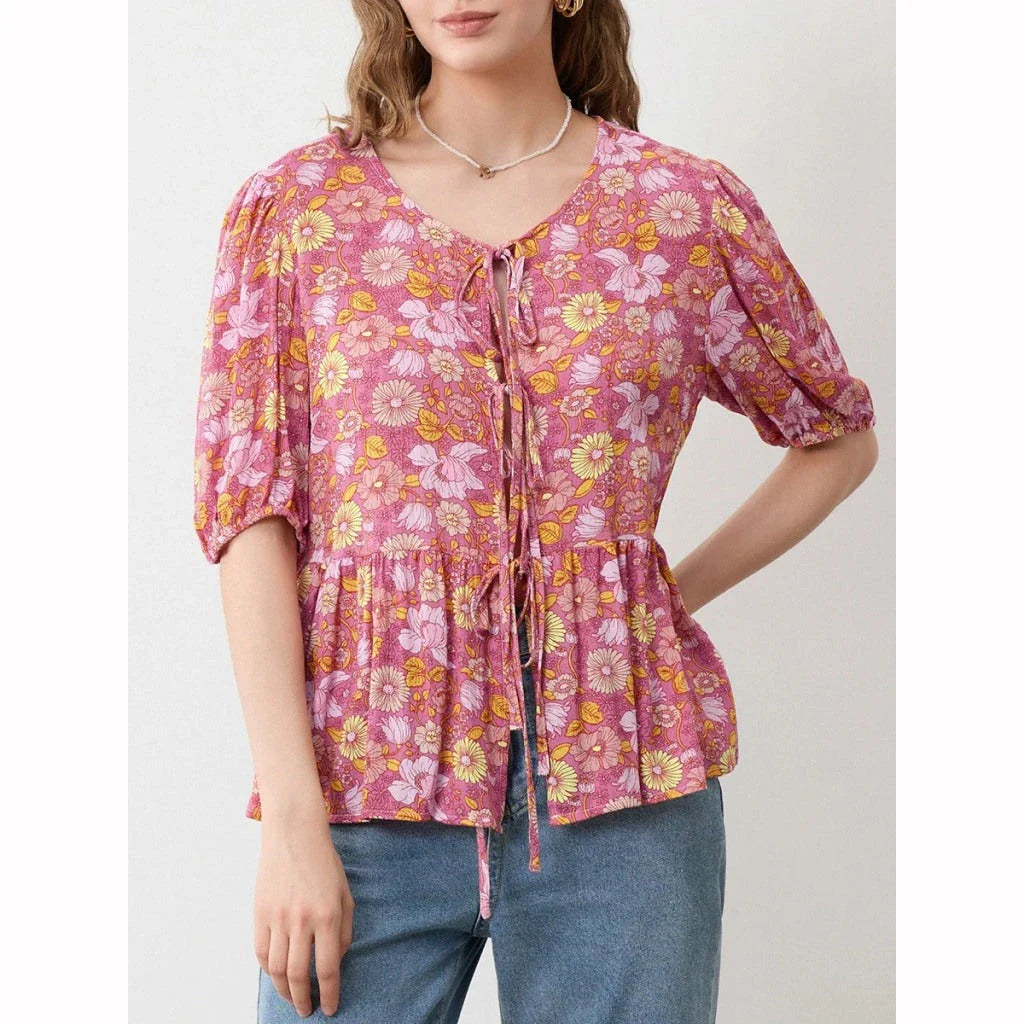 Elegant floral lace-up bow blouse with unique hollow-out details and a delicate floral print